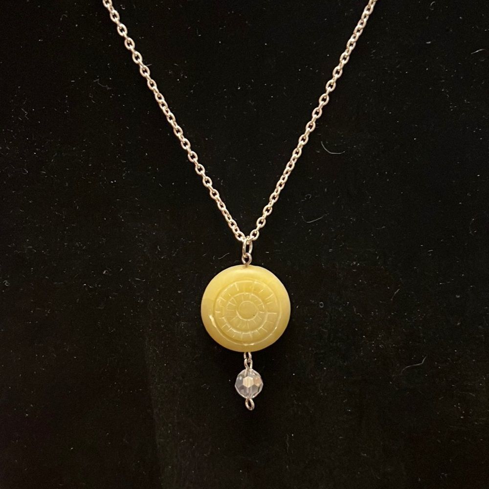 Handcrafted yellow pendant on a 21 inch silver tone chain